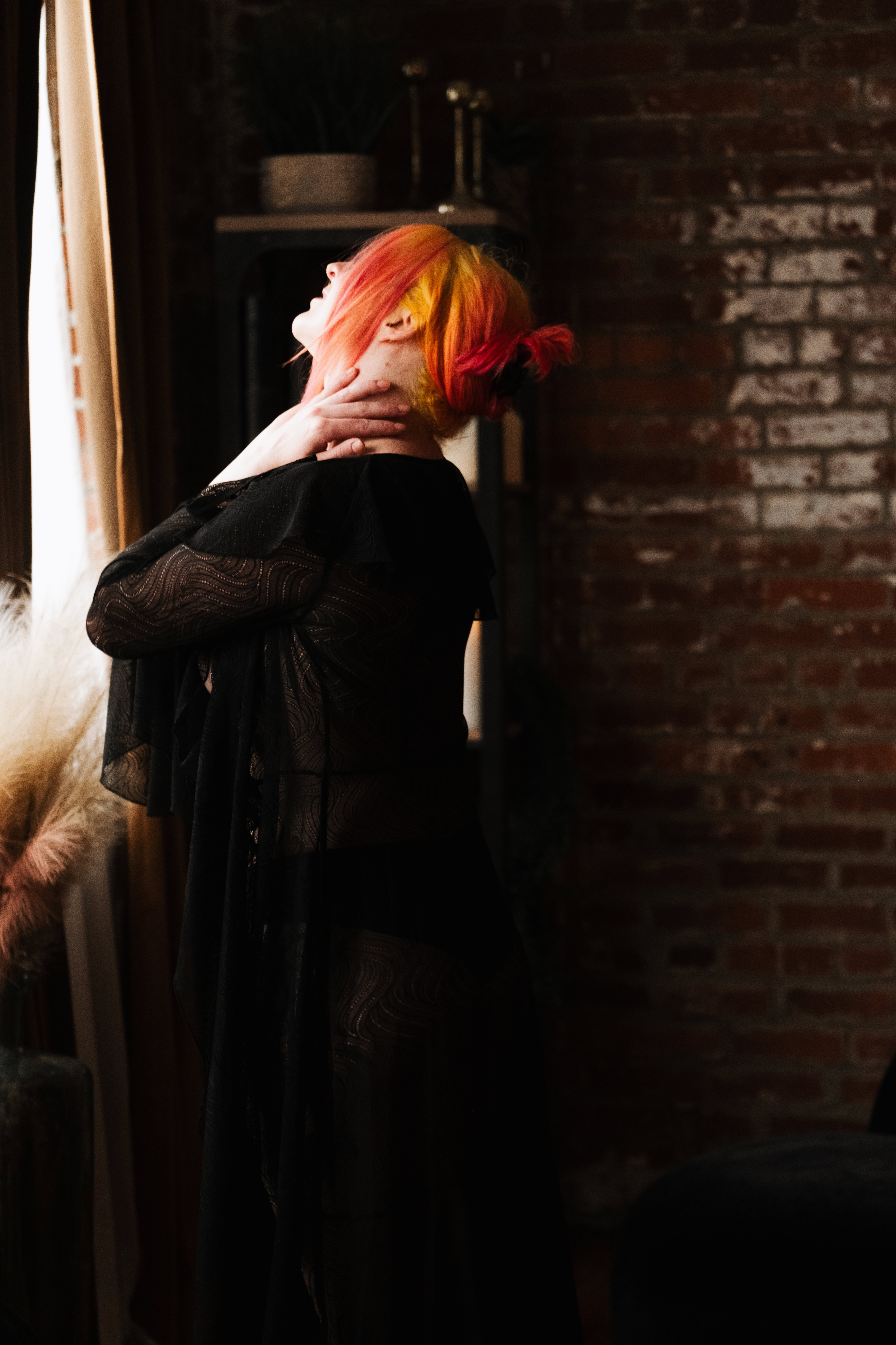 Pittsburgh boudoir photography woman with blonde and red hair posing for self love boudoir photoshoot